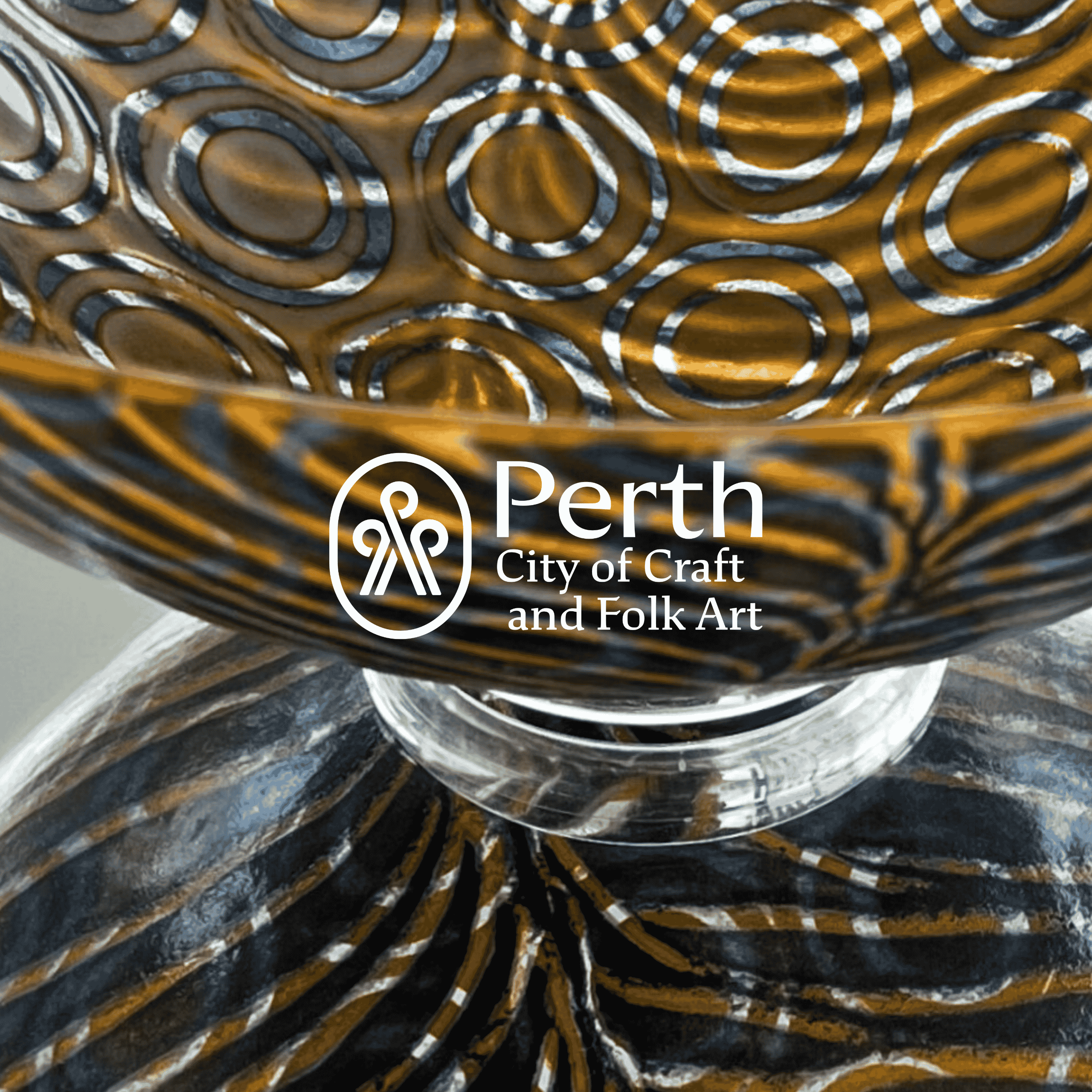 Culture Perth & Kinross - Perth City of Craft logo on close up of amber patterned glass bowl by Jane Drysdale